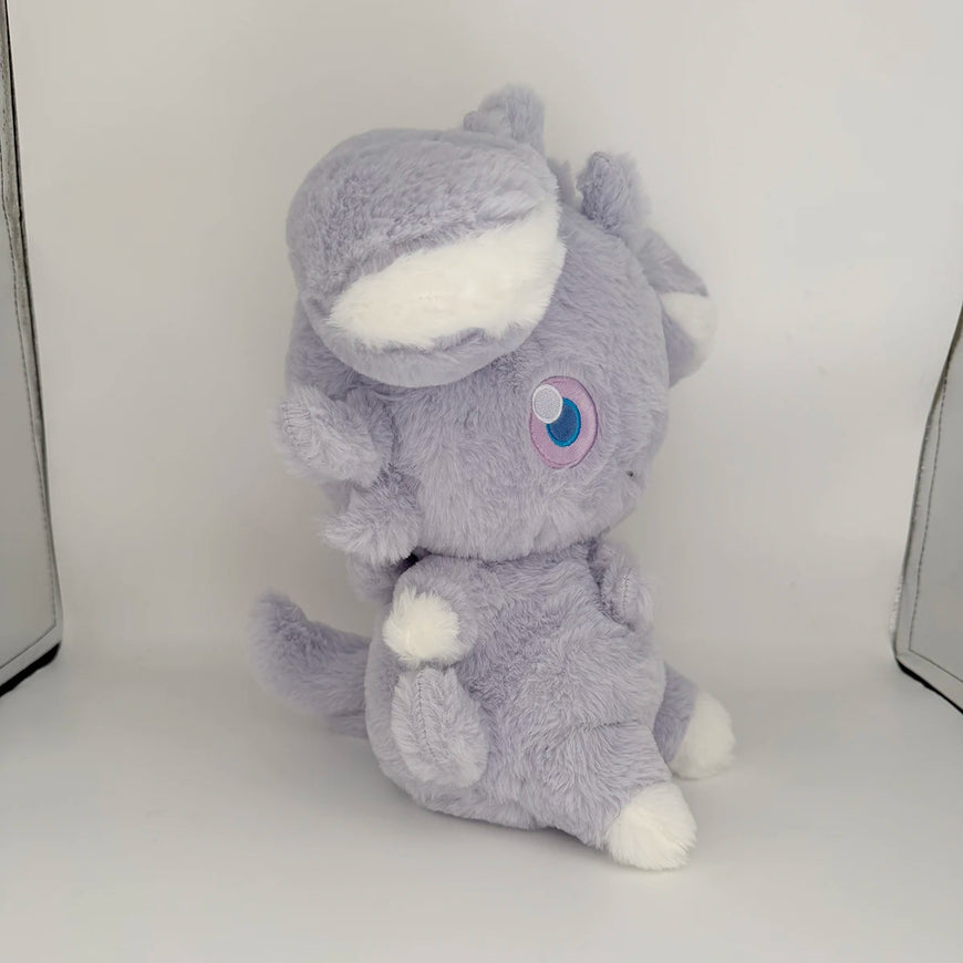 Gray plush toy with a white belly on a white background
