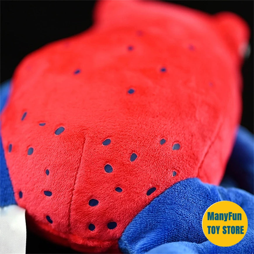 Close-up of a red and blue plush toy with a visible brand logo in the corner.
