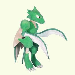 Green dragon-like plush toy on a light beige background