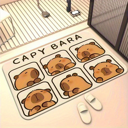 A rectangular bath mat with a cartoon capybara design and the text 'CAPY BARA' lies on a bathroom floor next to a shower base and a pair of white slippers.
