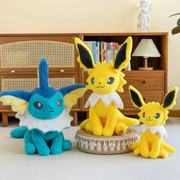 Three plush toys resembling Eevee, Vaporeon, and Jolteon in a room setting.