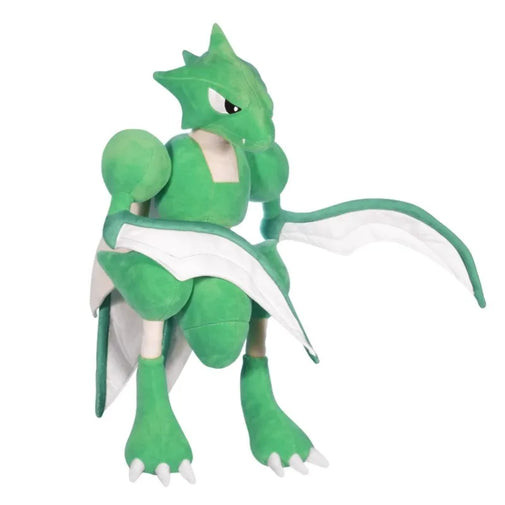 Green dragon-like plush toy on a white background