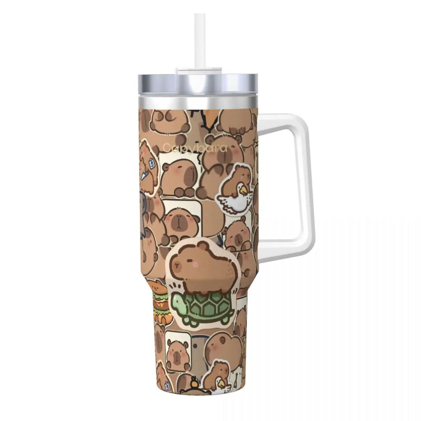 A stainless steel travel tumbler with a white handle and straw, decorated with a repeating pattern of cute capybara illustrations in various poses and activities. The tumbler is shown on a plain white background.
