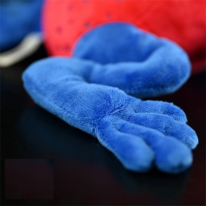 Blue plush toy paw on a dark surface with a red and blue background