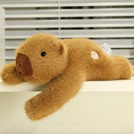 Brown teddy bear lying on a surface with blinds in the background