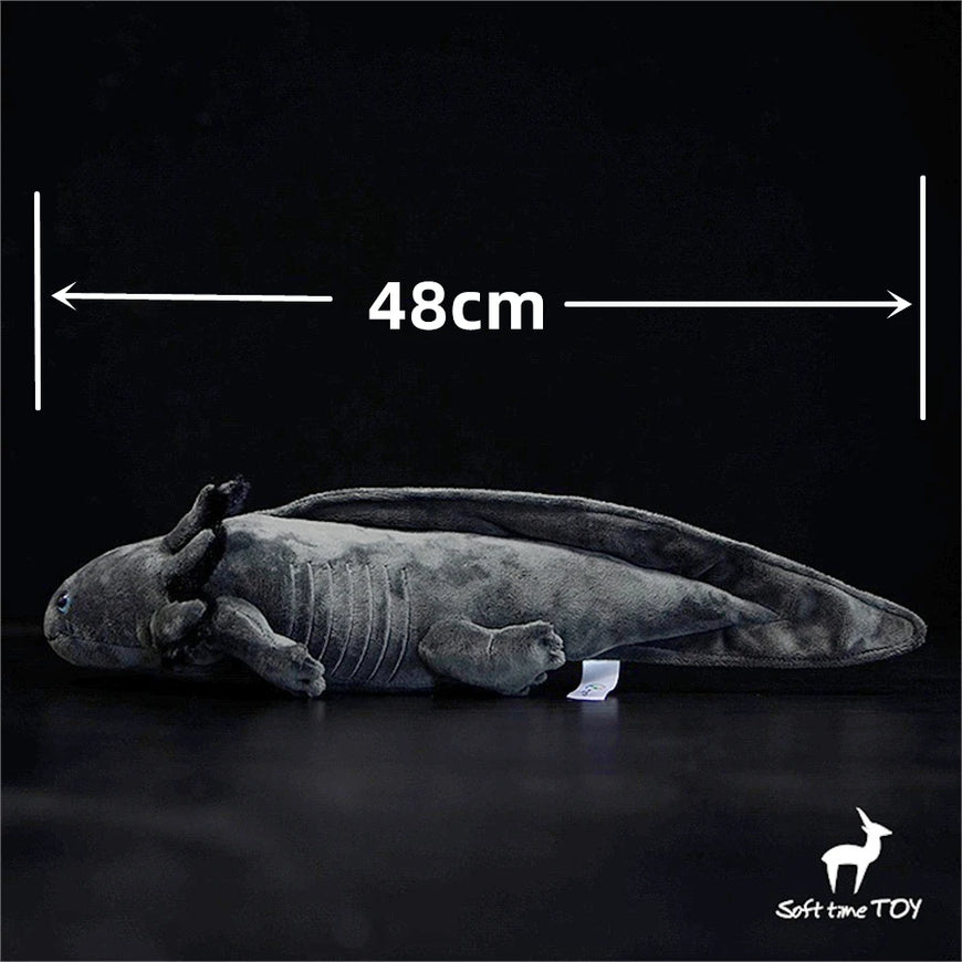 Plush toy axolotl with measurement label on a black background