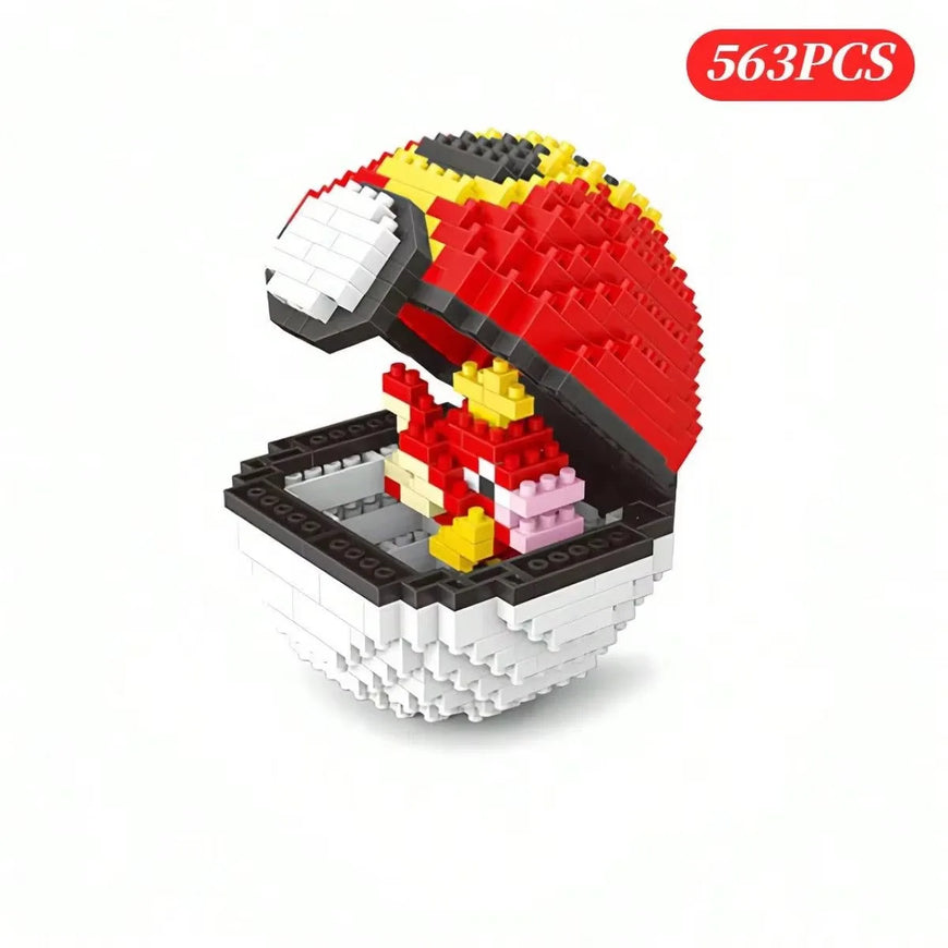 A 563-piece toy building block set shaped like a Pokéball with a red and black top half, white bottom half, and a small red, yellow, and pink character inside, shown on a white background with a red '563PCS' badge.