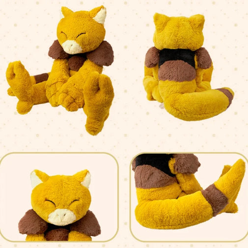 A plush toy shown in four views on a light cream background with subtle dots. The toy is a yellow fox-like character with brown patches, a dark collar, and a white muzzle.
