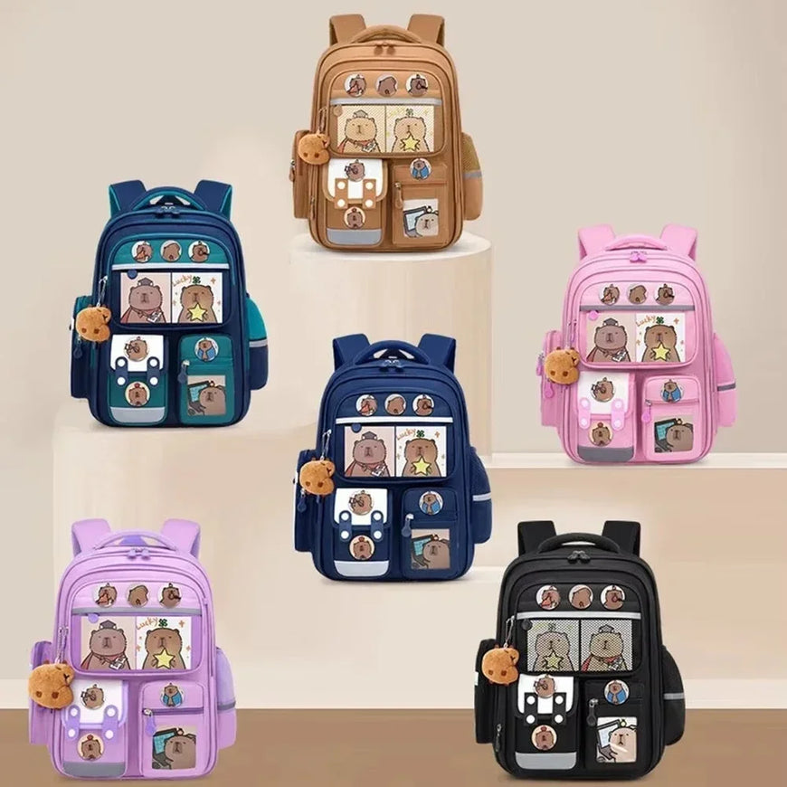 Set of colorful backpacks with cartoon character designs on a beige background