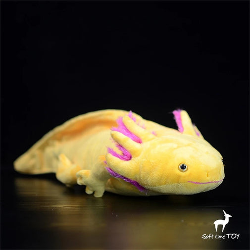 Yellow axolotl plush toy with pink markings on a black background