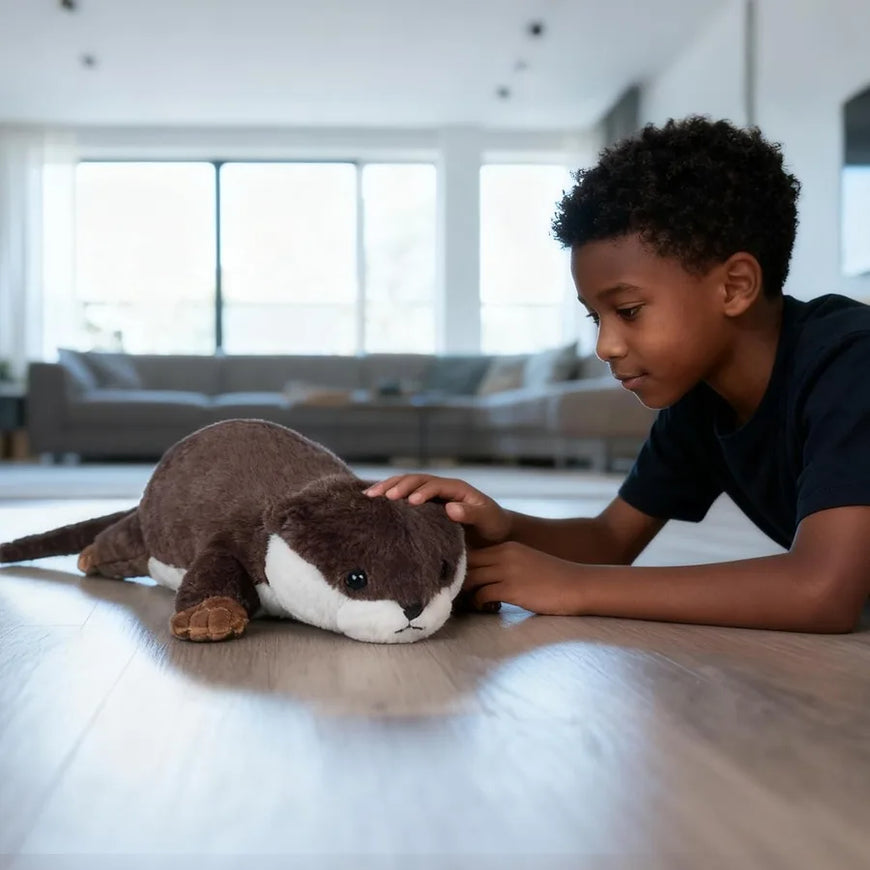 Child playing with a plush otter toy on a light-colored floor.