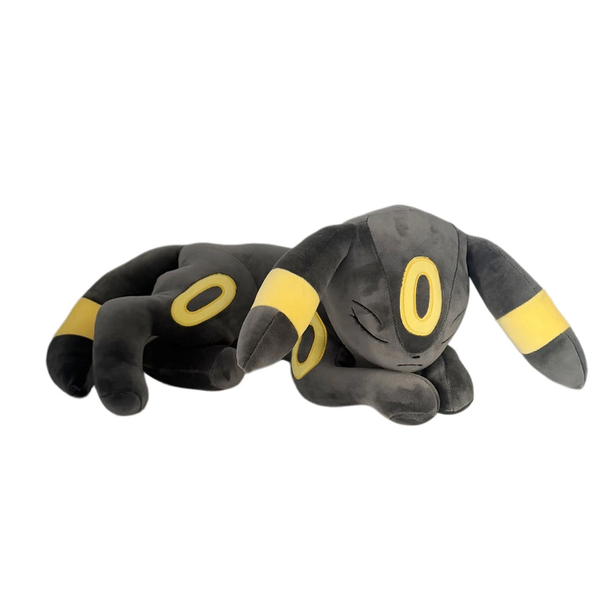Plush toy resembling a gray and yellow creature on a white background