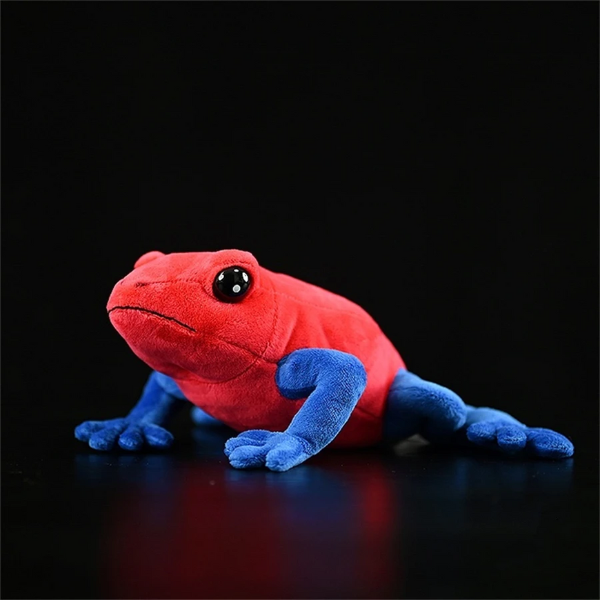 Red and blue plush toy frog on a black background